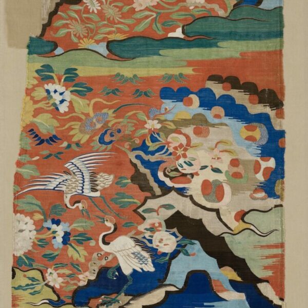 A silk kesi panel with cranes in a landscape